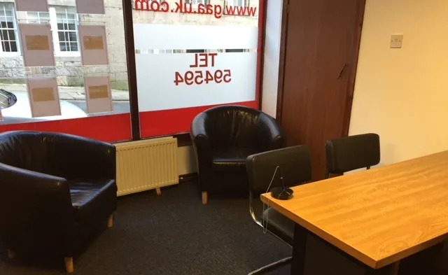 The agency’s waiting area and desk